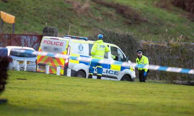 Police cordon off an area of the Newburgh coast following the discovery of a body.