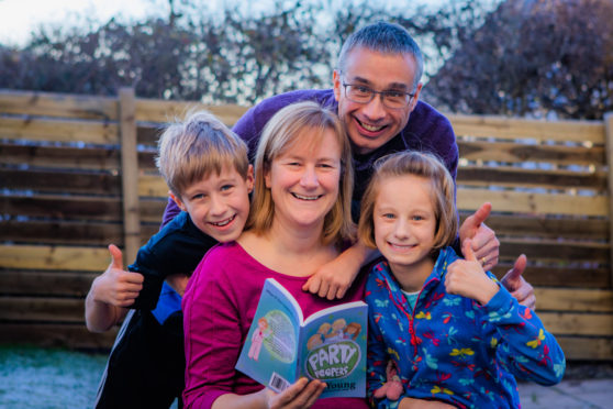 Jill Young at home with her family: husband John and 11 year old twins Fraser and Hayley. Picture: Steve MacDougall.