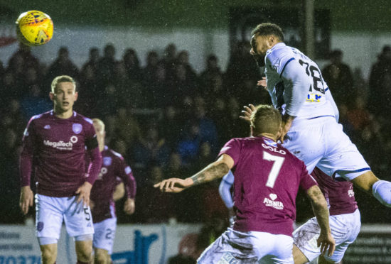 Kane Hemmings scores for Dundee at Gayfield.