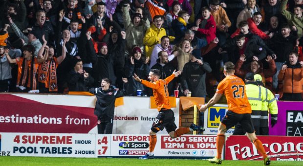 Nicky Clark celebrates making it 1-0 to United.