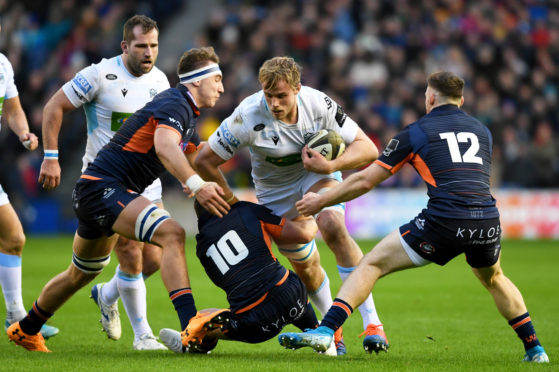 Jonny Gray carries the ball for Glasgow at Murrayfield.