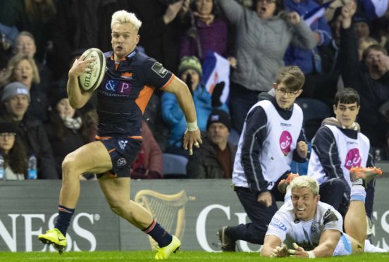 Darcy Graham escapes DTH van der Merwe's desperate tackle to break away and score Edinburgh's clinching try at Murrayfield.