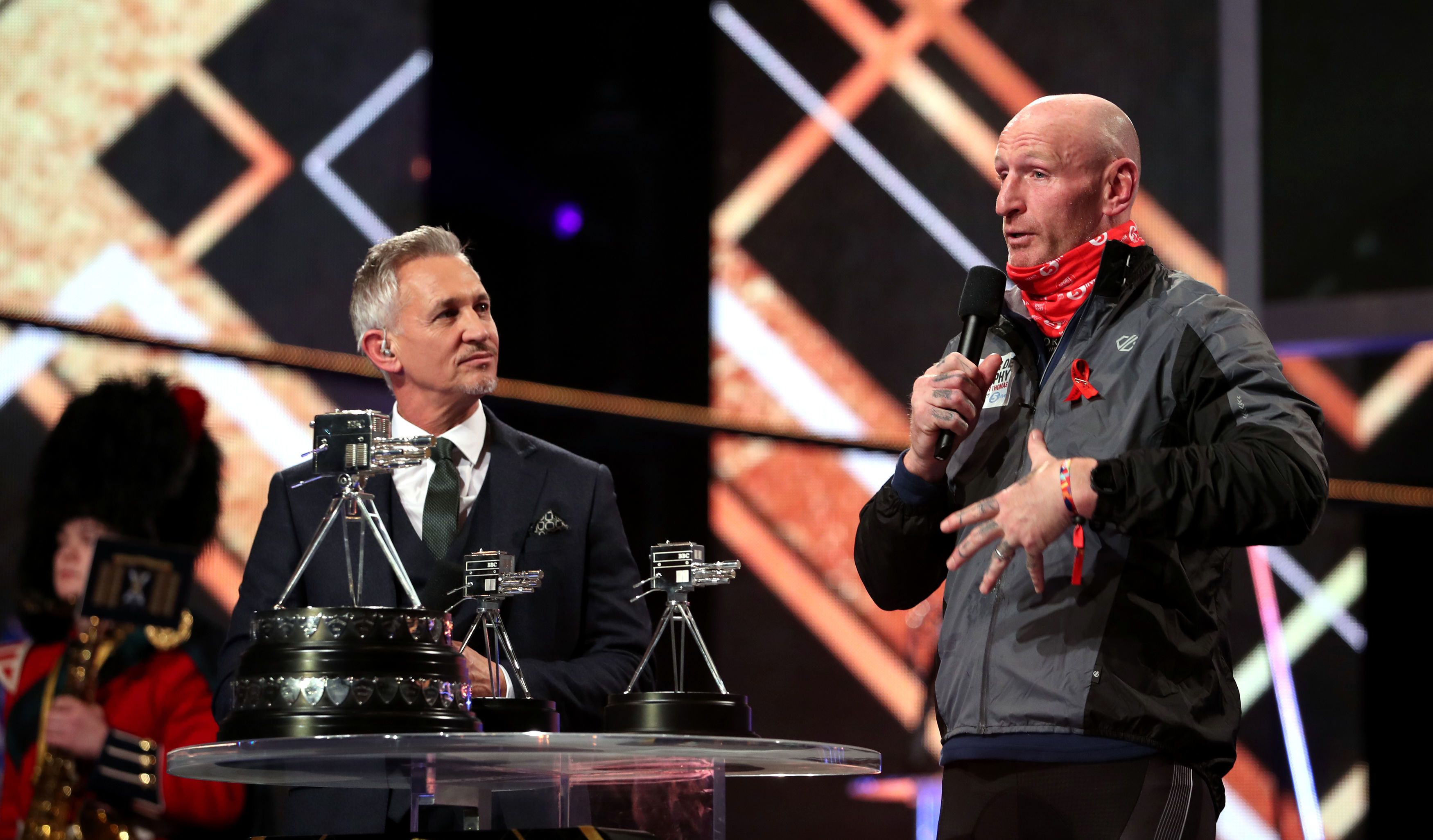 Former rugby player Gareth Thomas brings the Sports Personality of the Year Award to the stage during the BBC Sports Personality of the Year 2019 at the P&J Live, Aberdeen.