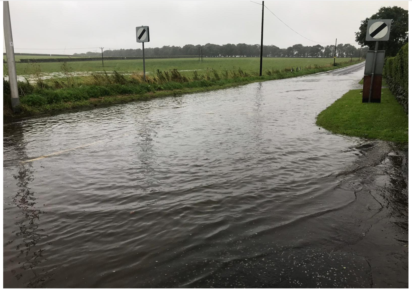 A picture of the road beside the site following recent rainfall.