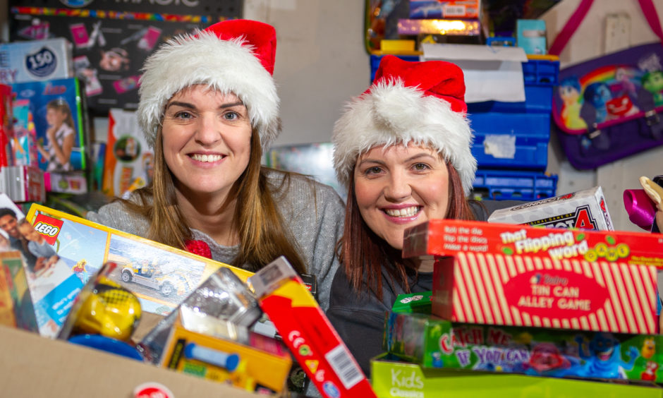 Cupar-based social workers Laura Lumsden and Victoria Leonard with some of the donations to Toy Drive in December 2019