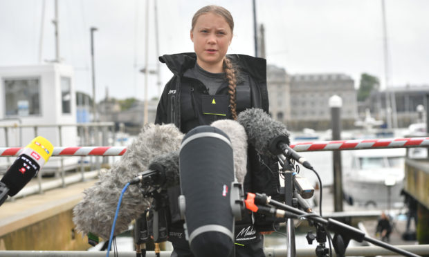 Climate activist Greta Thunberg speaking to the media before she began her voyage to the US from Plymouth on the Malizia II in 2019