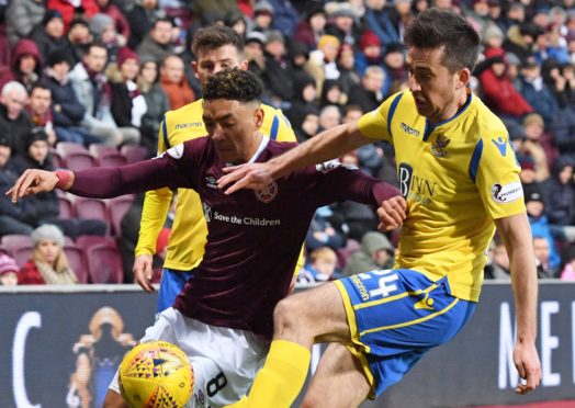 Callum Booth closes down Sean Clare of Hearts.