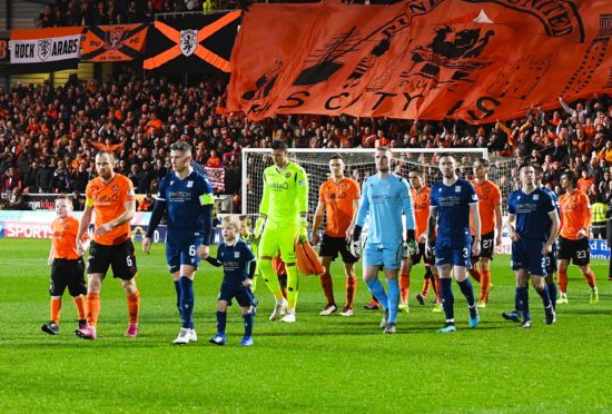 The teams walk out for kick-off.