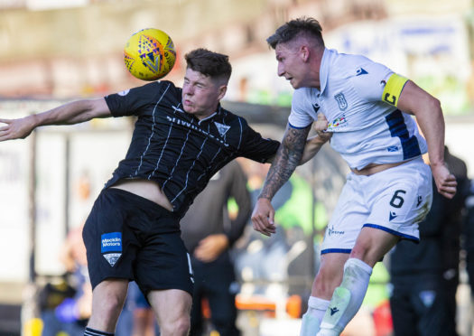 Kevin Nisbet challenges for a high ball with Josh Meekings.