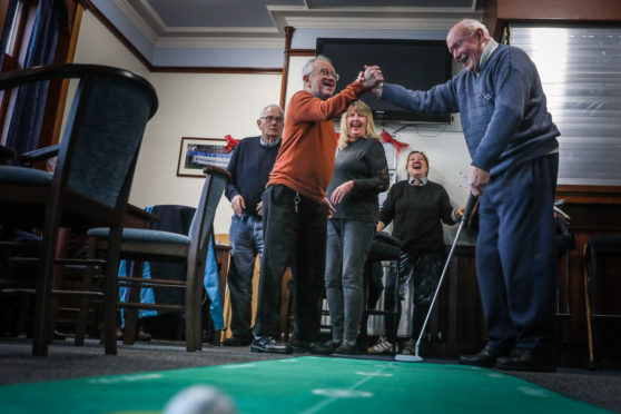 Members on the 'putting green' at the latest meeting of the new group.
