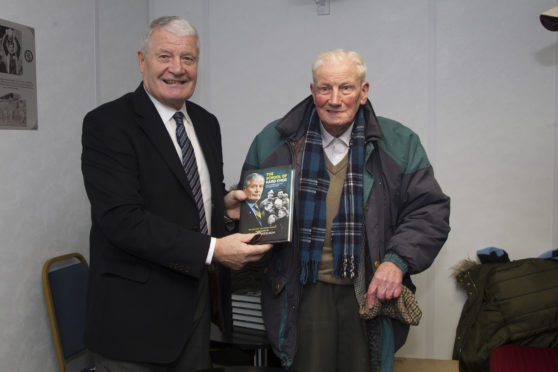 Archie Knox signing his book for Mr Smart when he was 95.