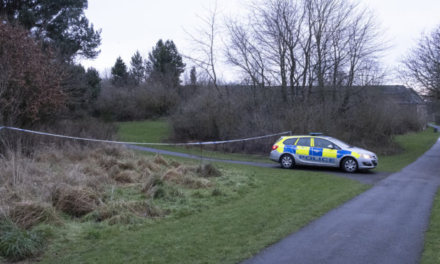 Police at the cordoned off area at the end of Dens Road, Arbroath.