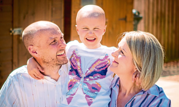 Ruby with her parents Andy and Claire.