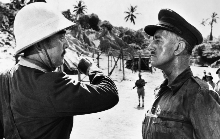 Colonel Saito (Sessue Hayakawa) faces off with Lieutenant Colonel Nicholson (Alec Guinness), the embodiment of the stiff upper lip, in the 1957 film The Bridge Over The River Kwai.
