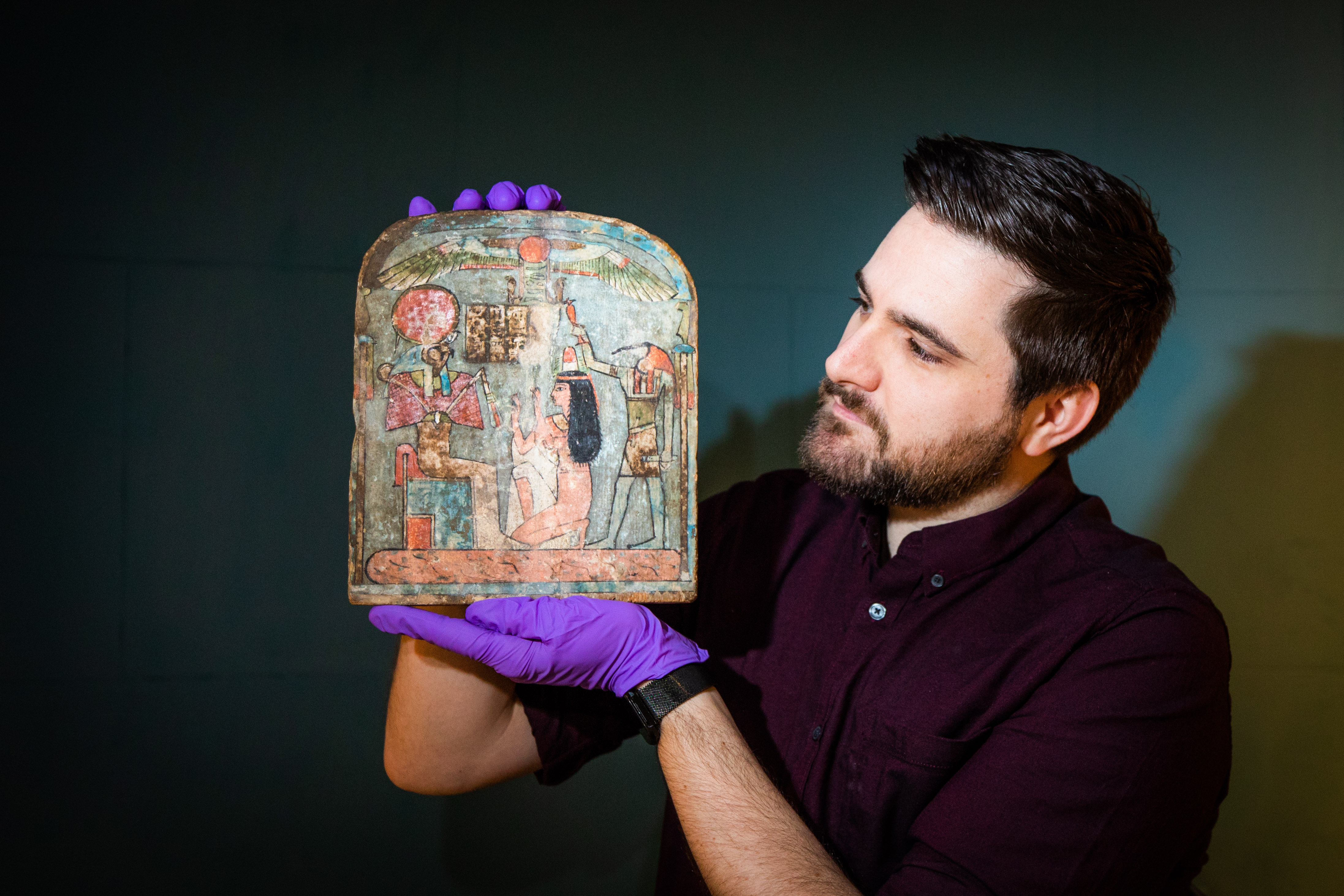 Dr Dan Potter (assistant curator National Museum of Scotland) with a piece from the displays.