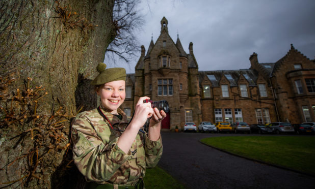 Arwen Moses (aged 15) with her camera.