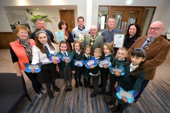 Figures involved in a Tayside Biodiversity Partnership and Angus Council-led project to protect the Small Blue butterfly gathered to celebrate an awards success last week.