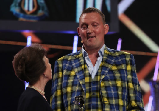 Doddie Weir receiving Helen Roll-on Award from The Princess Royal during the BBC Sports Personality of the Year 2019. Picture: Jane Barlow/PA Wire.