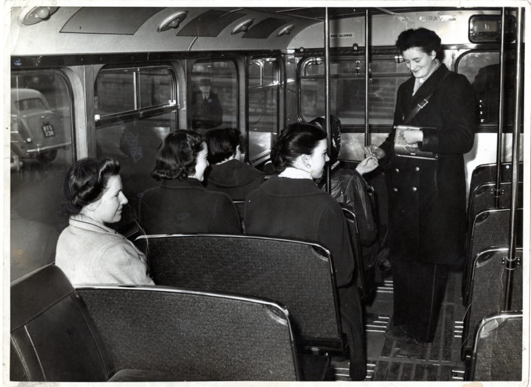 A clippie on a Dundee bus in 1955.