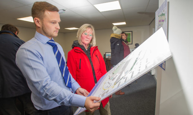 L to r - Ryan Brown (Land Manager GS Brown) and visitor to the event outling the proposals, Lorna Pattison, Mackie Motors, Clerk Street, Brechin, 15th January 2020, Kim Cessford / DCT Media.