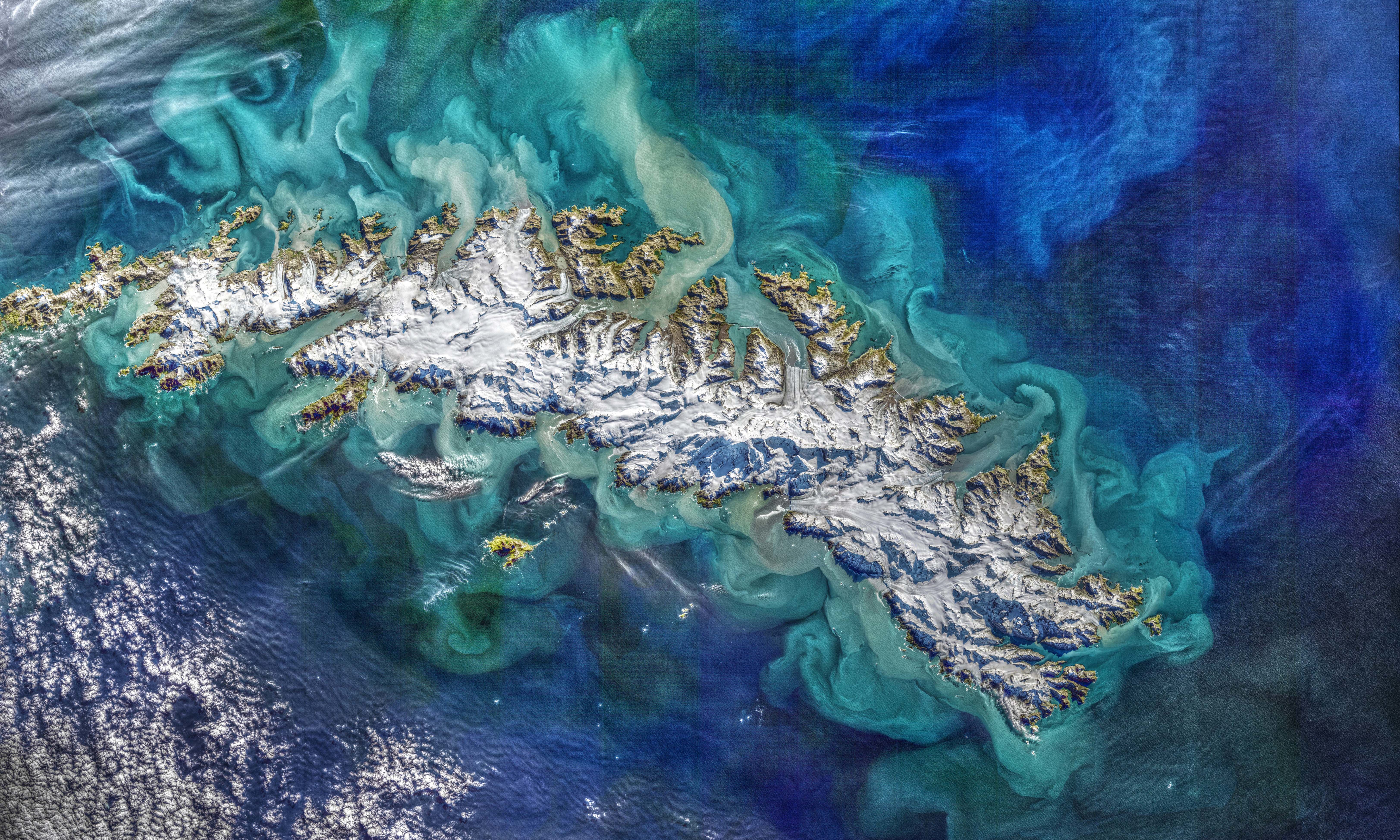 South Georgia Island from space, showing the sea-ending glaciers and their nutrients/sediments flowing into the South Atlantic