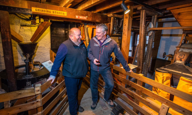 Colin Tennant (Historic Environment Scotland) and right is David Strachan (Director Perth & Kinross Heritage Trust) discuss plans for Lower Mills