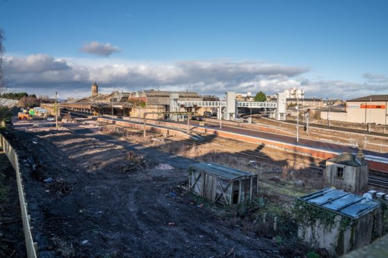 Railway tracks at Perth railway station of where trees have been felled.