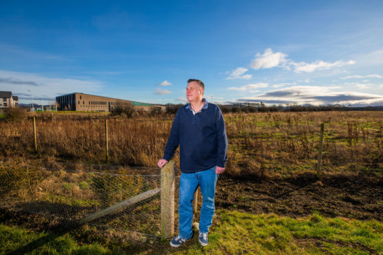 Councillor John Rebbeck at the site in Bertha Park