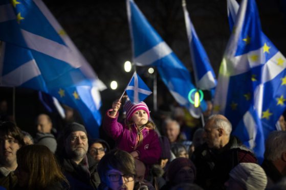Pro-EU campaigners take part in a 'Missing EU Already' rally outside the Scottish Parliament on Brexit night.