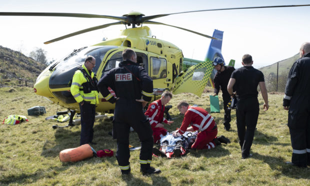 SCAA paramedics Rich Garside and Daz O'Brien transporting a casualty from an accident site in Dollar Quarry