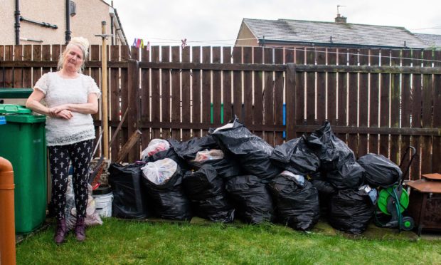 Evelyn Grieve, who has not had her bins emptied for a whole year due to a dispute with a neighbour.