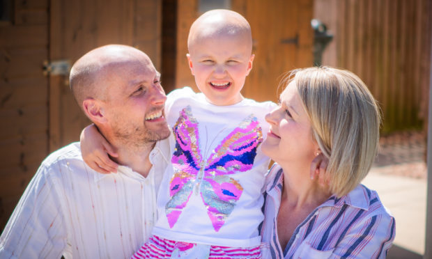 Ruby Stewart with parents Andy and Claire at home in Inchture, June 2019