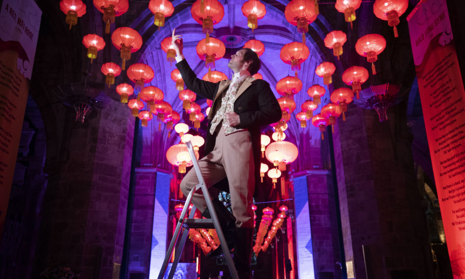 Actor Gareth Morrison as Rabbie Burns lights up the display of Chinese Lanterns in St Giles' Cathedral, Edinburgh, for the start of the Chinese New Year celebrations.