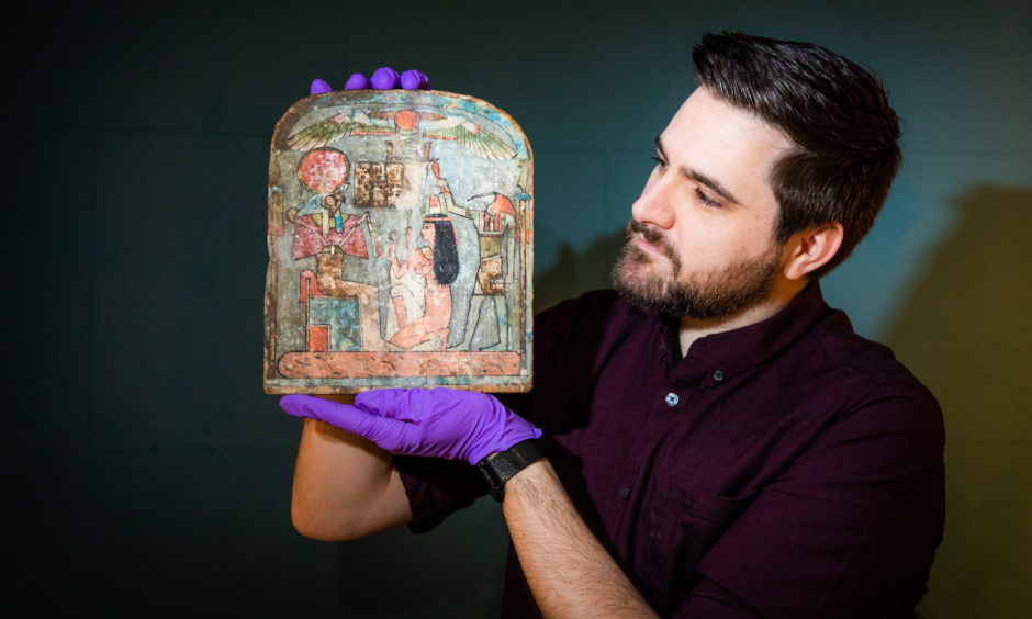 Picture shows Dr Dan Potter (Assistant curator National Museum of Scotland) with a piece from the Discovering Ancient Egypt exhibition at Perth Museum.