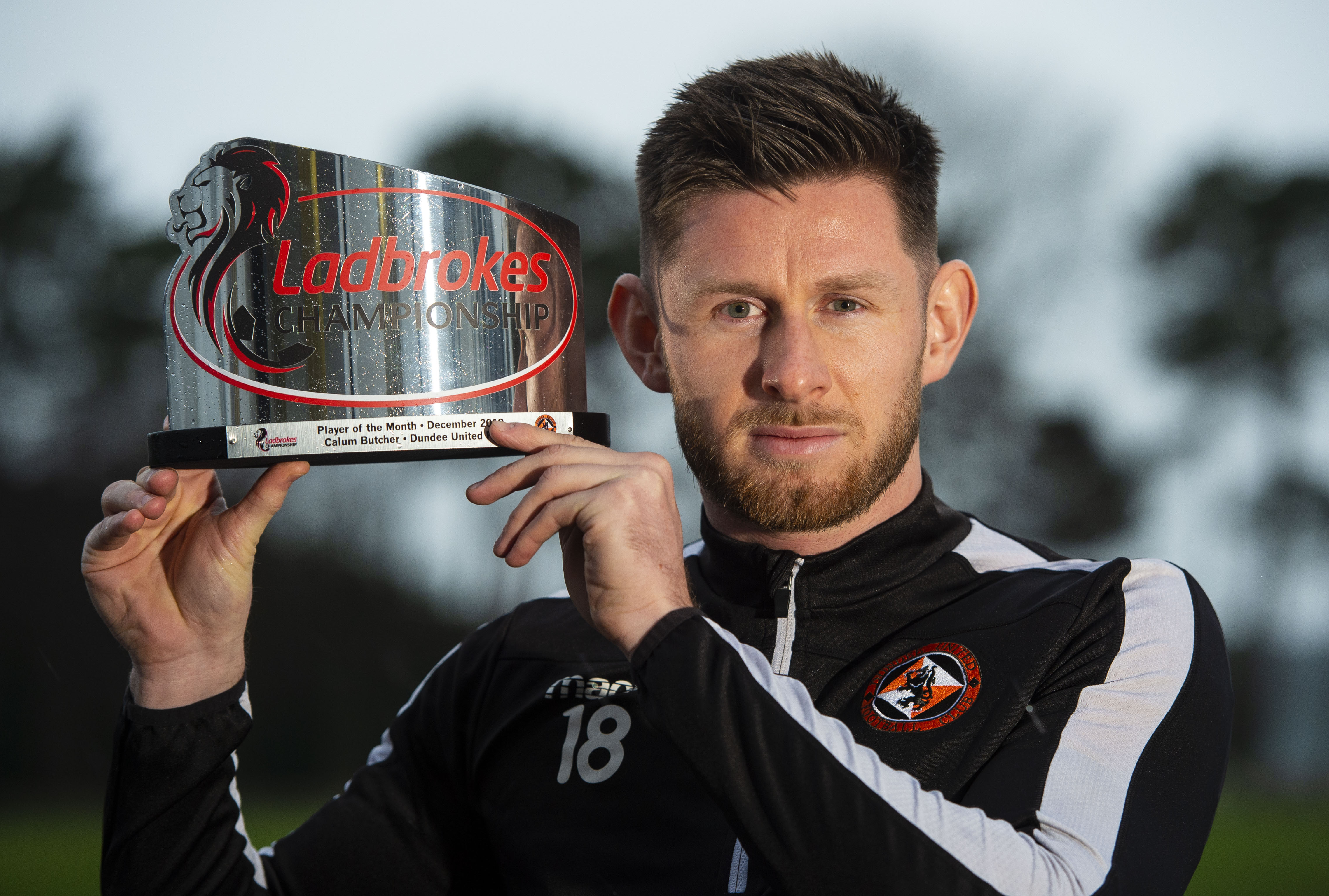 Calum Butcher with his player of the month award.