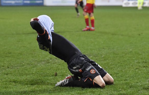 Lawrence Shankland celebrates his third goal in style.