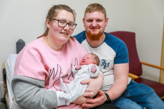 Mum Stephanie Mackie (34) and dad Shaun Mackie (25), from Glenrothes, with new baby girl Evie Mackie.