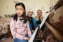 Fife youngster Zimeng Chen with piano tutor Sister Avril Landay and Maggie Picken from Skiffington Trust.