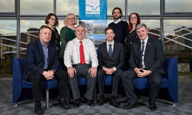 From back left, Lauren Miller Business Gateway, Alison Henderson Dundee & Angus Chamber of Commerce, Brian McNicoll University of Dundee, Gill Simpson Scottish Enterprise, front, councillors Angus Forbes Perth & Kinross Council, Tommy Stewart Angus Council, John Alexander Dundee City Council  and Councillor  Craik Fife Council.