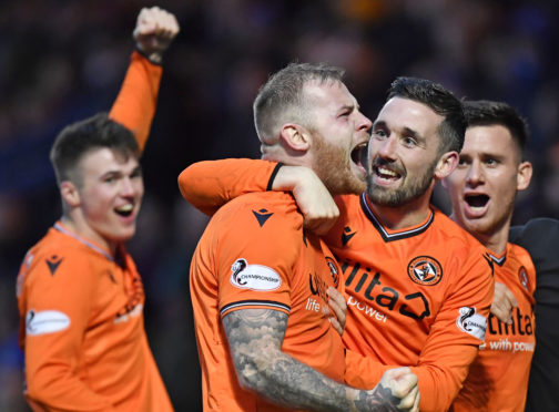 Dundee United defender Mark Connolly (centre) is relishing the test of the Premiership.