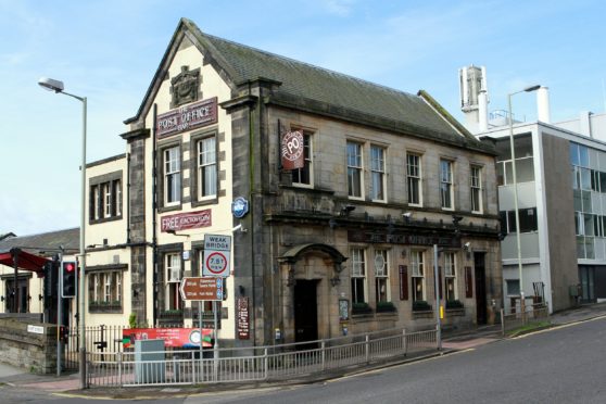 The man exited a bus near the Post Office Bar