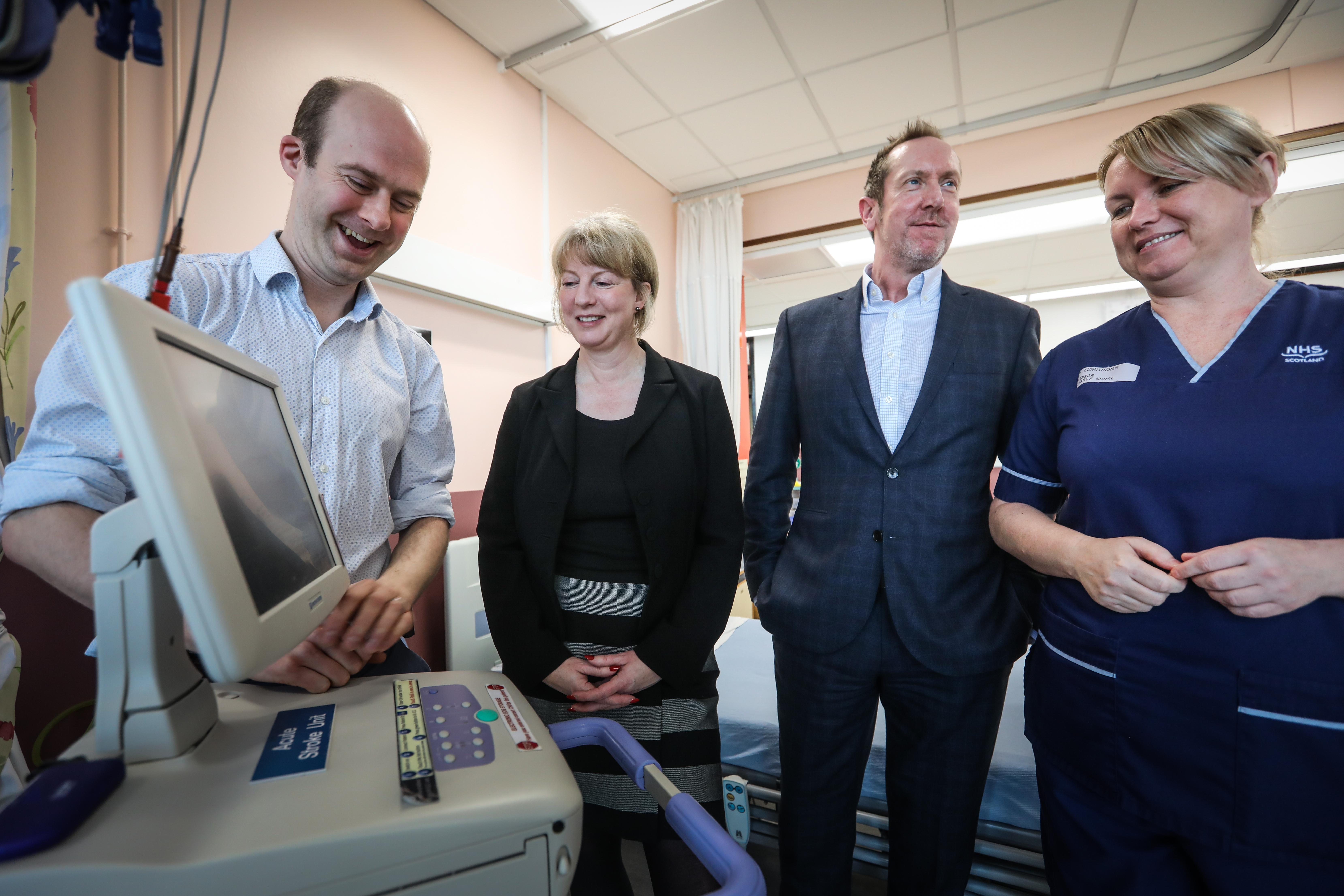 Dr Matthew Lambert, Consultant and Clinical Lead for Stroke in Ninewells, Shona Robison MSP, Stroke Association Colin Oliver and Senior Charge Nurse Fay Cunningham with an ECG machine.