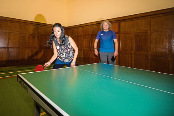 Gayle has a bash at table tennis with Dundee and District Table Tennis Association and is given some tips from Arthur Pritchard.