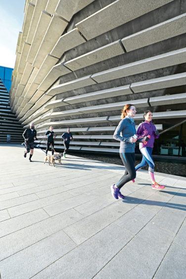 Run Talk Run attendees heading past the V&A by Dundee's Waterfront.