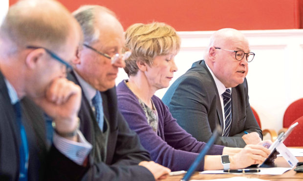 Director of Finance Ian Lorimer, councillor 
Angus MacMillan Douglas, chief executive Margo Williamson and council leader David Fairweather in Forfar on Monday.