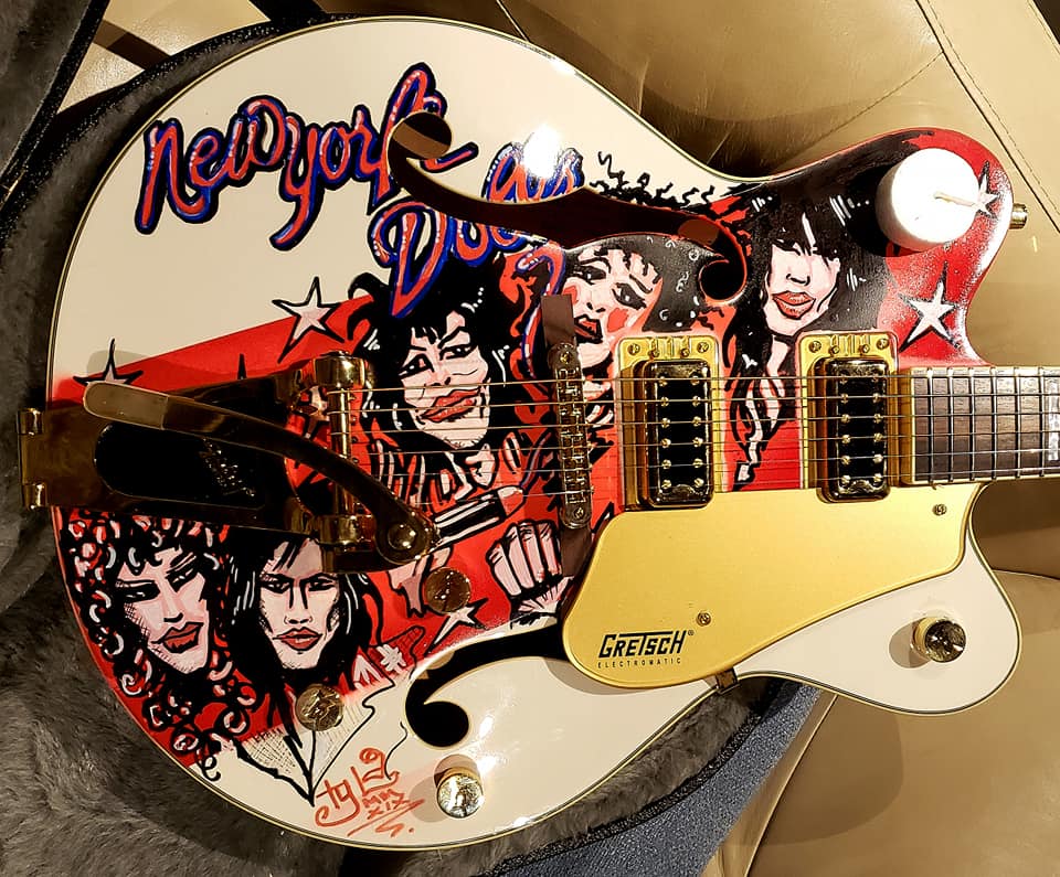 The one-off guitar has been signed by a host of rock legends.