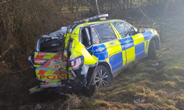 The damaged police vehicle.