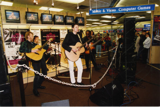 Big Country performing a record store gig in Dundee in 1994.