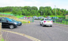 Parked vehicles stack up near Forfar Primary School.
