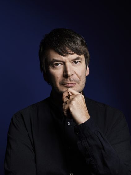 Photo is a studio portrait of the crime author Ian Rankin